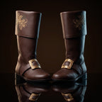 Pair, close together, buckles crossed: Pair of black leather Santa Claus boots with gold embroidered reindeer design on fold-over cuffs and engraved gold buckle straps
Pair, front-facing: Front view of black genuine leather Santa Claus boots showing gold thread reindeer embroidery and ornate gold buckle detail
Single boot, 3/4 profile: Single black leather Santa Claus boot with gold reindeer embroidery cuff and engraved buckle strap, side profile view